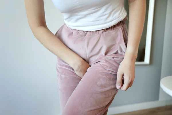 woman running for the toilet because of urinary incontinence World's End